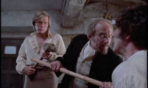 Kronos (Horst Janson) and Professor Grost (John Cater) try to discern the best way to dispatch Dr. Marcus (John Carson) in Brian Clemens’ Captain Kronos: Vampire Hunter (1974)