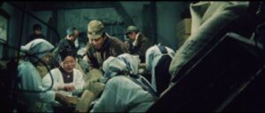 Kawada (Noboru Andô) distributes stolen supplies to local poor people in Tai Katô’s Eighteen Years in Prison (1967)