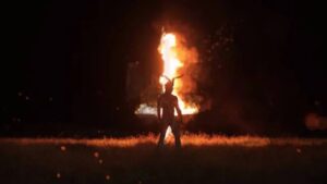 Lara Levonde (Georgia Eyers) has visions of a demon and fire in Nick Kozakis’ Godless: The Eastfield Exorcism (2023)