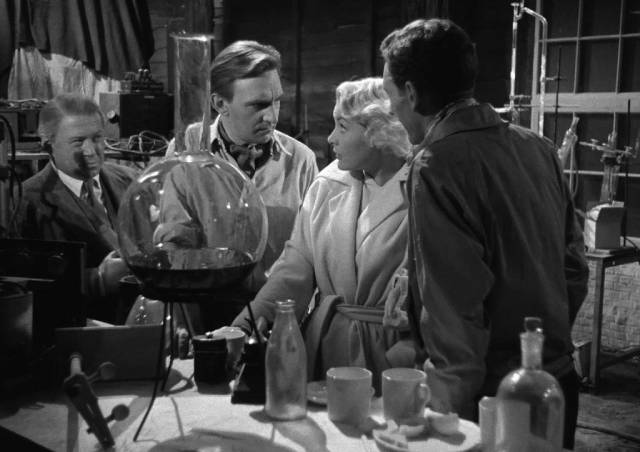 Reconnecting with Bill (Stephen Murray) and Robin (John Van Eyssen), Lena (Barbara Payton) devotes herself to the traditional role of domestic support in Terence Fisher's Four Sided Triangle (1953)