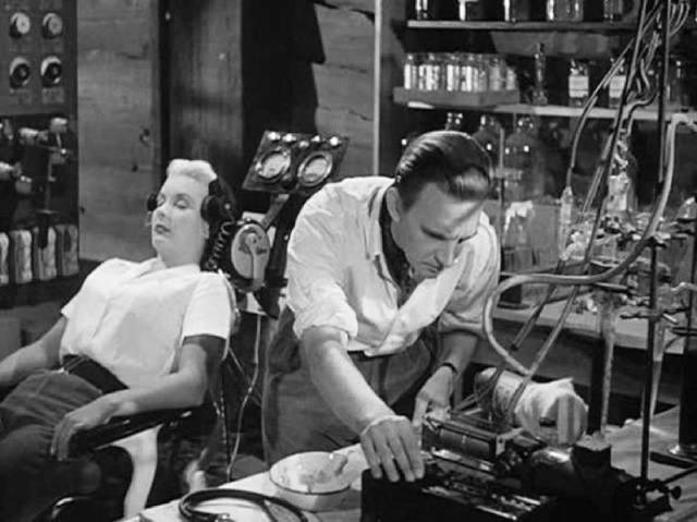 To satisfy his own emotional needs Bill (Stephen Murray) prepares to erase Helen (Barbara Payton)'s memories in Terence Fisher's Four Sided Triangle (1953)