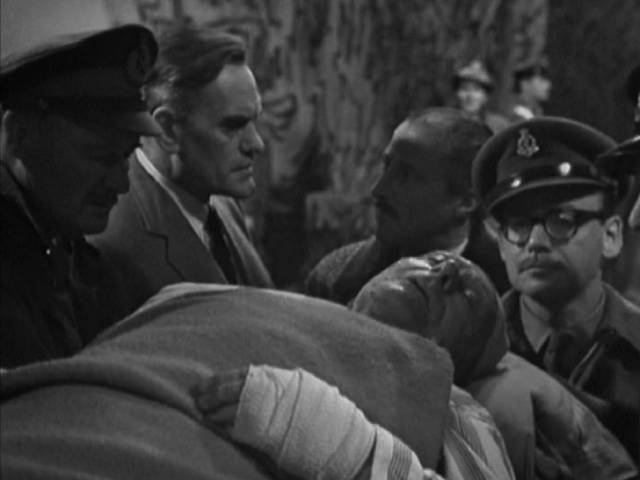 A victim of radiation burns confirms the presence of the nuclear bomb in Nigel Kneale's The Crunch (Michael Elliott, 1964)