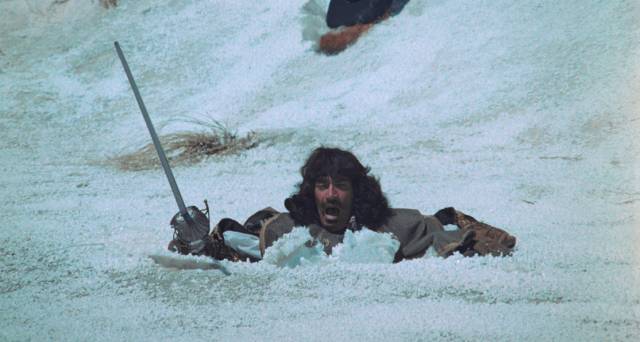 Porthos (Frank Finlay) attempts to join the fight on a frozen river in Richard Lester's The Four Musketeers (1974)