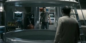 A nervous technician (Nacho Vigalondo) tells Héctor (Karra Elejalde) to get into the tank in Nacho Vigalondo's Timecrimes (2007)