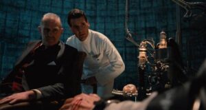 Jack Lint (Michael Palin) and Minister of Information Helpmann (Peter Vaughan) realize Sam Lowry (Jonathan Pryce) has retreated into a permanent fantasy in Terry Gilliam's Brazil (1985)
