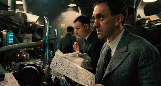 Sam Lowry (Jonathan Pryce) is happy to go unnoticed in the Department of Records in Terry Gilliam's Brazil (1985)