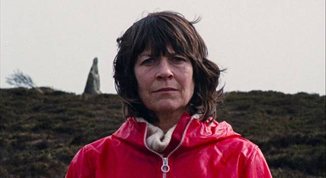 The Volunteer (Mary Woodvine) gradually merges with the island in Mark Jenkin's Enys Men (2022)
