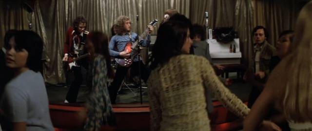 Success in local clubs leads to an unexpected opportunity in Richard Loncraine's Flame (1975)