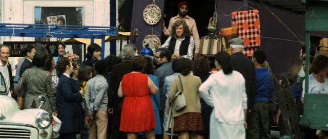 Stoker (Noddy Holder) doesn't expect to succeed and keeps his day job in the local market in Richard Loncraine's Flame (1975)