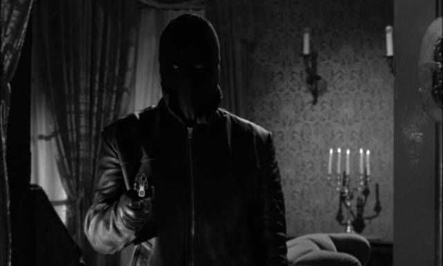 A hooded murderer menaces an English estate in Harald Reinl's The Strangler of Blackmoor Castle (1963)
