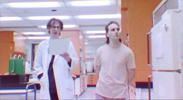 Al (Greg Hanec) can't even feign interest in his friend's long poem in Greg Hanec's Think at Night (2024)