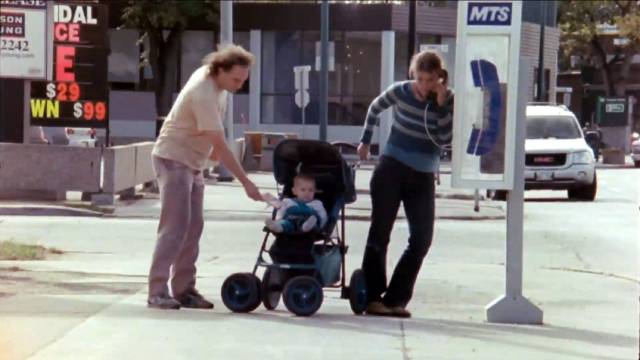 Al (Greg Hanec) drops Dana (Alerry Lavitt)'s unwanted money into a random baby's lap in Greg Hanec's Think at Night (2024)