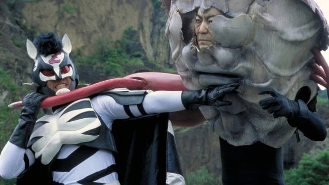 Sad-sack teacher Shin'ichi (Shô Aikawa) becomes a superhero fighting aliens in Takashi Miike's Zebraman (2004)